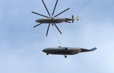 Экипаж вертолета МИ-26 ОАО НПК «ПАНХ» провел уникальную работу по транспортировке крупногабаритного груза.  Фюзеляж вертолета Ми-26 на внешней подвеске был доставлен из Москвы в Краснодар.